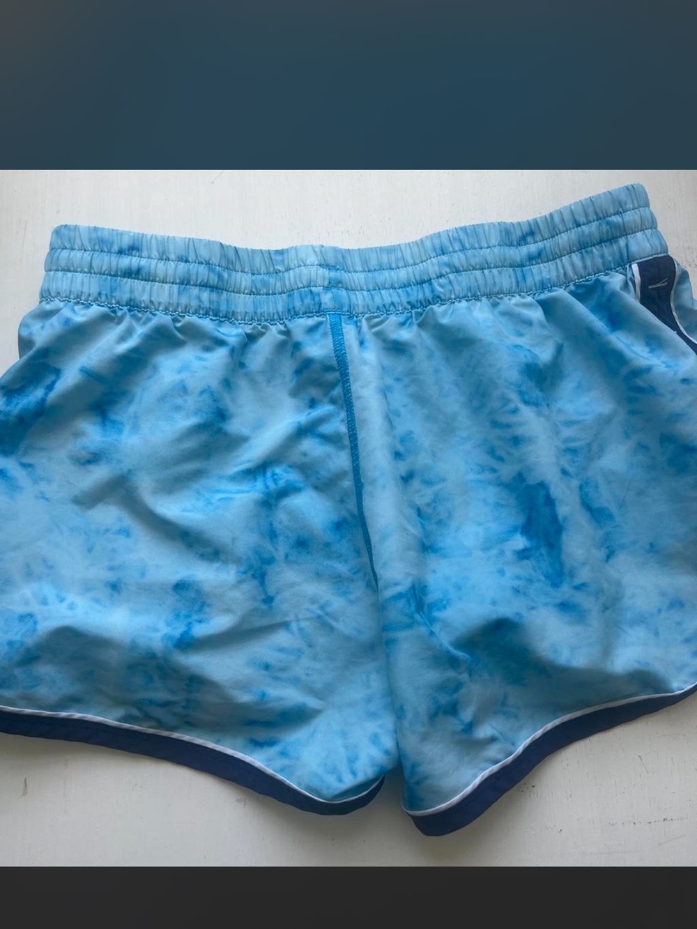 Under Armour Women's Light Blue Tie-Dye Running Shorts with Navy Trim